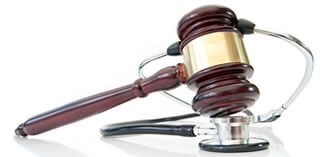 gavel on top of a stethoscope