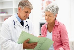 doctor showing a patient their chart