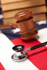 stethoscope and gavel on a flag
