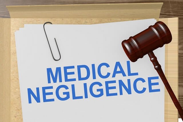 Paper that says medical negligence and a gavel