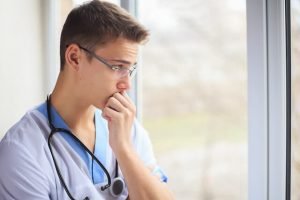 physician looking out the window