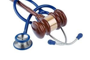 A blue stethoscope and gavel