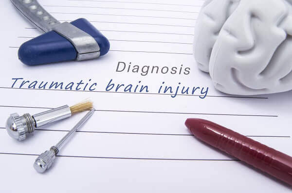 Traumatic brain injury diagnosis on a physician chart.