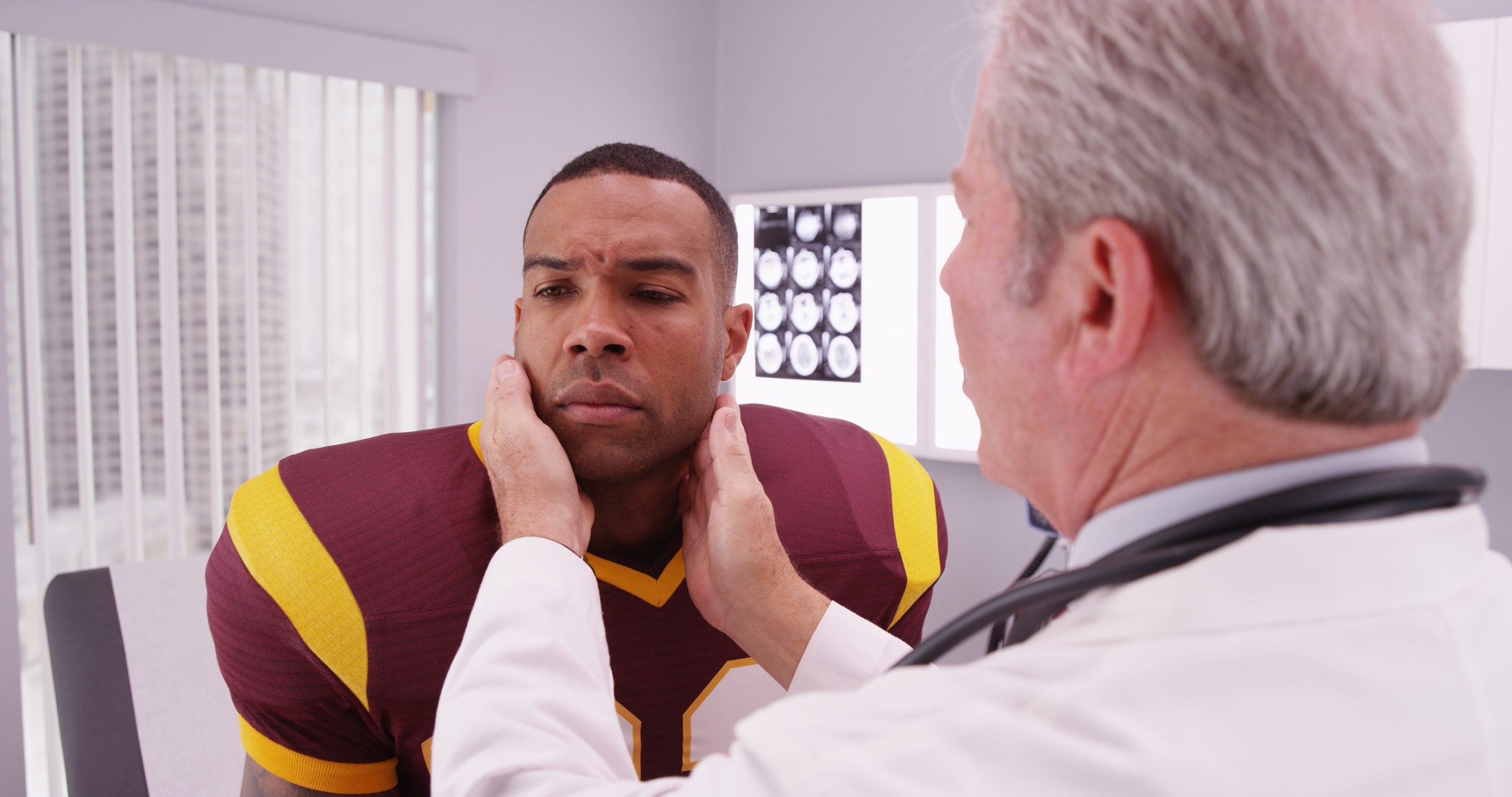 Football player with doctor