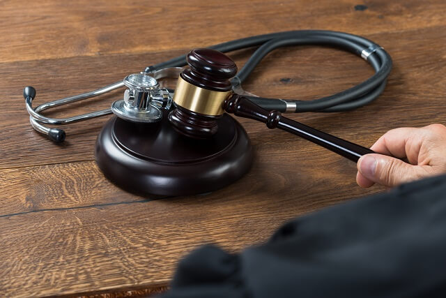 gavel with a stethoscope right next to it