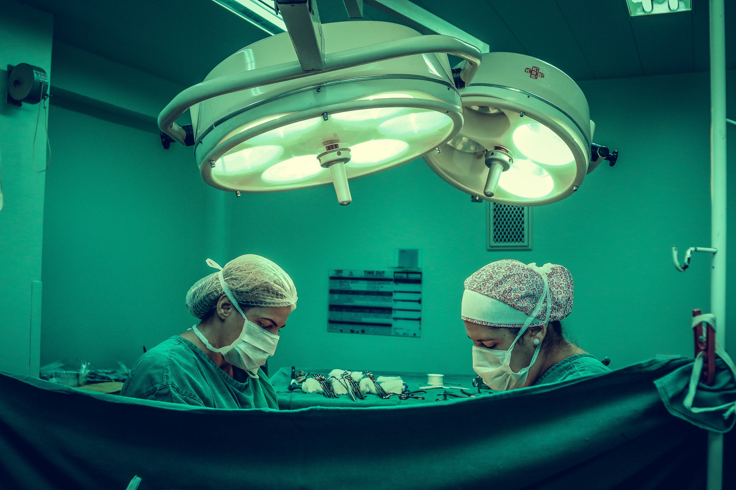 Two people doing surgery